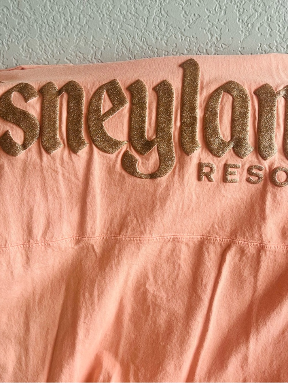 Disney Parks Coral Pink spirit jersey with gold logo